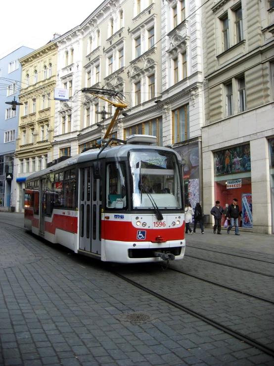 a trolley car going through the street