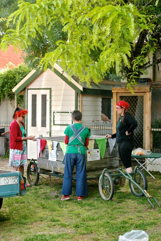 a group of people that are standing by some bikes