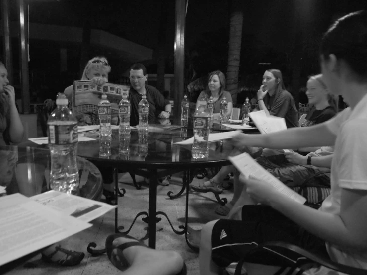 a group of people sit at a round table