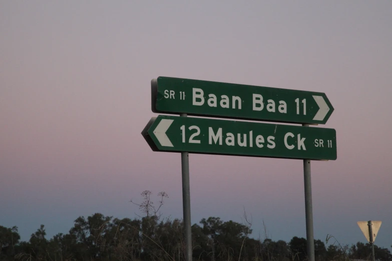 the road signs points to various destinations