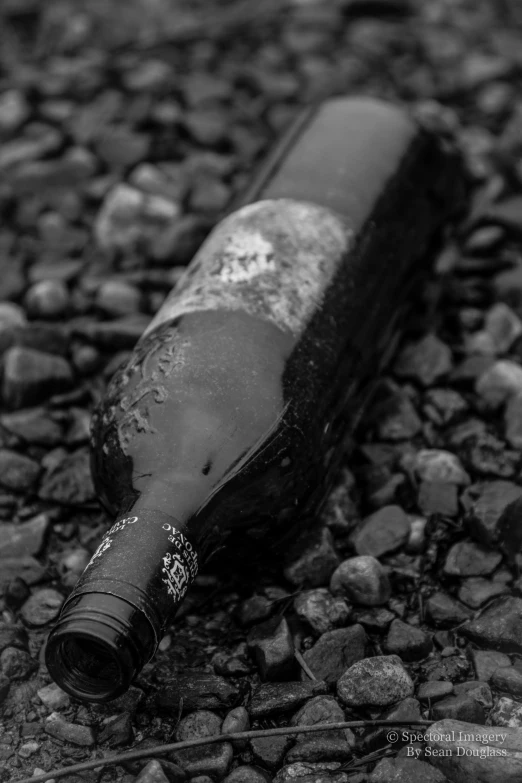 a black and white pograph of a broken bottle