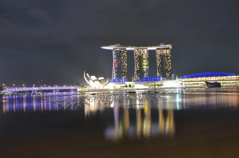 a city with some tall buildings in it at night