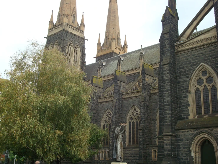 an old church with many windows and spires