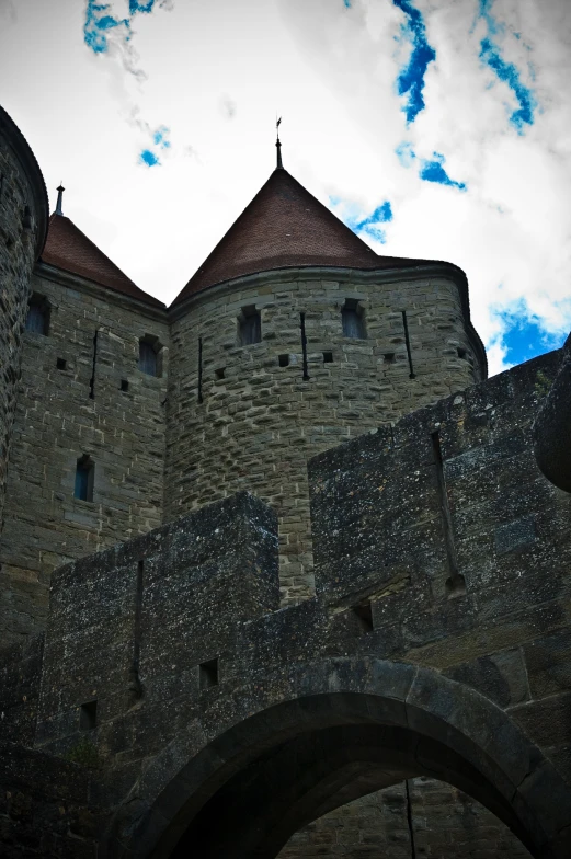 a castle is shown against the blue sky