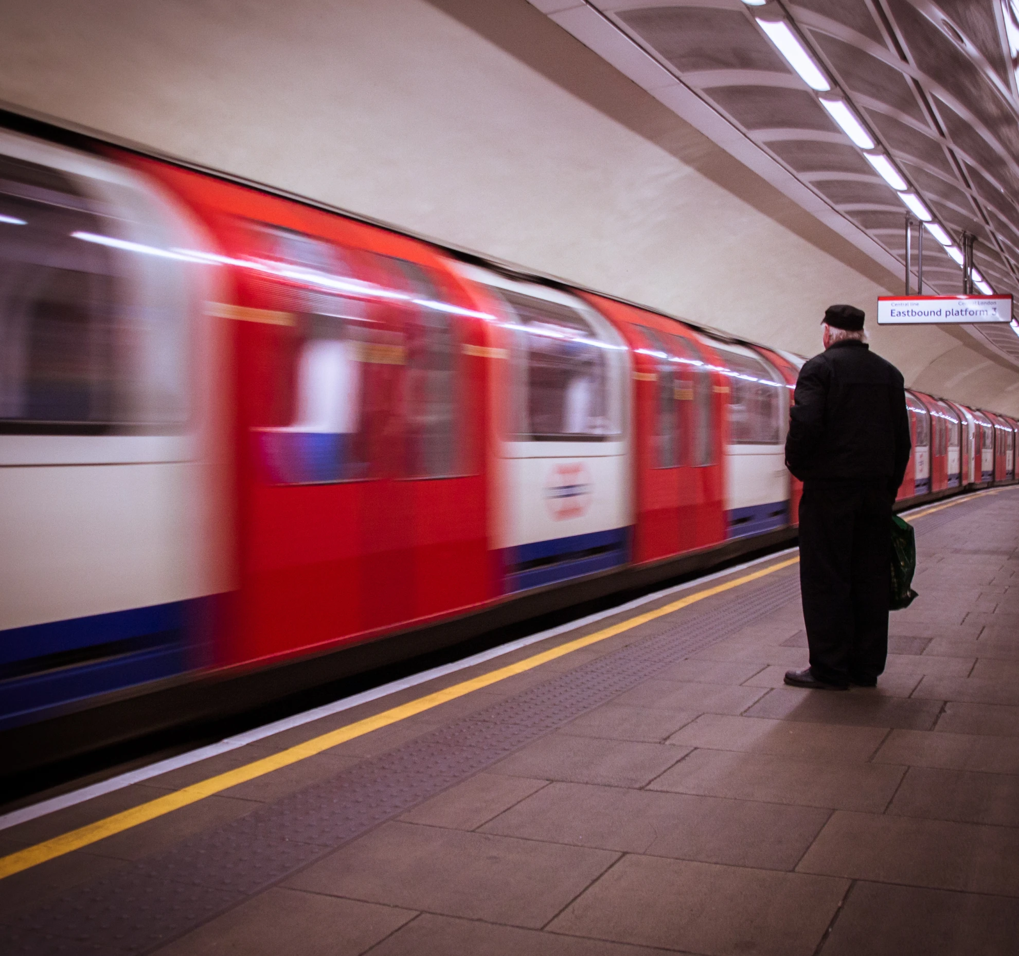 the man is waiting for the train to come