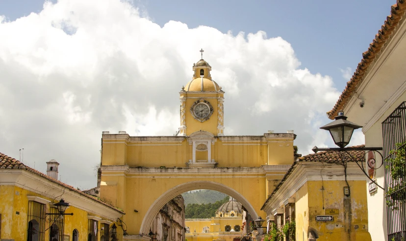 a clock is displayed on the yellow wall of a building