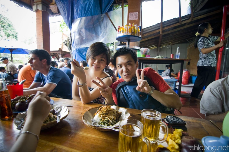 a bunch of people are sitting at a table