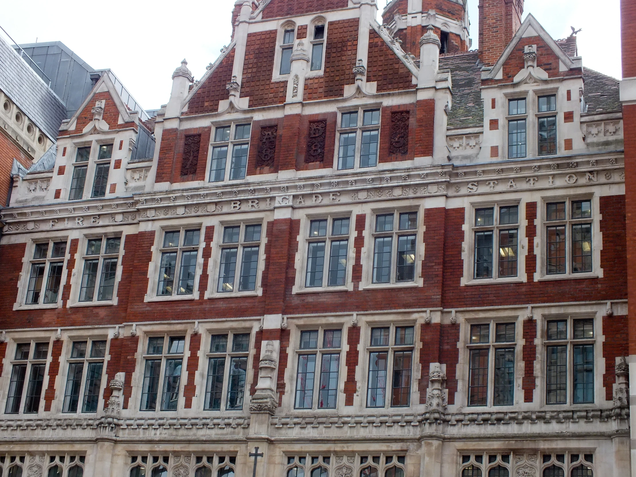 a tall building with many windows and clock towers