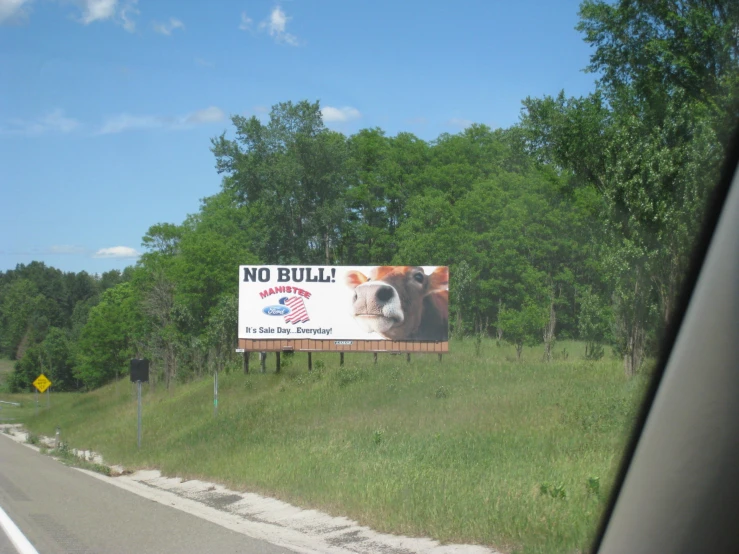 an advertit on a billboard in a rural area