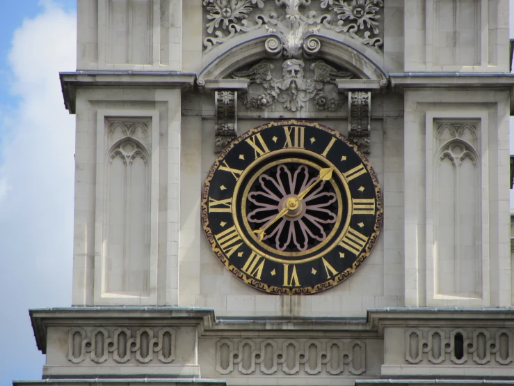 there is a very large clock tower with many details