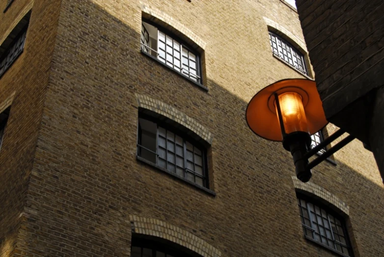 a lamp with windows is on an old fashioned street light