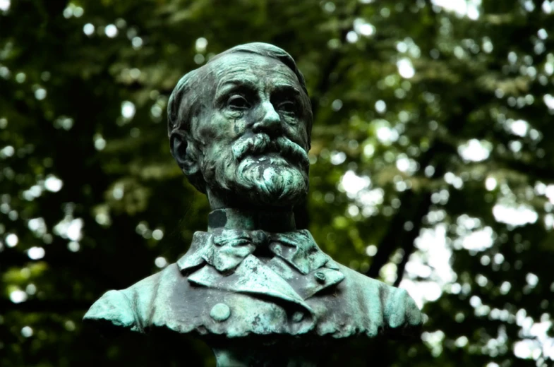 a statue in a park is shown