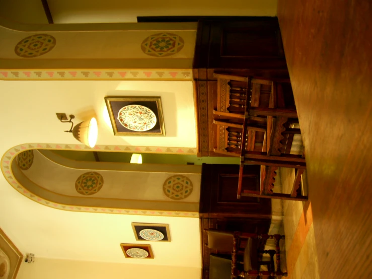 a large clock on the side of a wall in a room