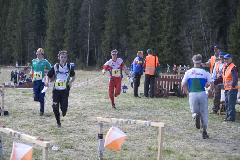 two men are competing in a cross country race