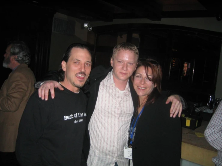 a group of friends poses for a po in a club