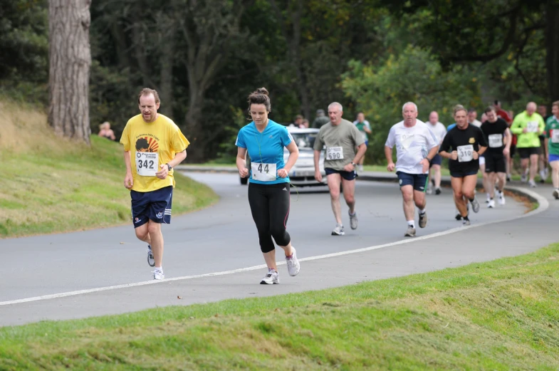 a group of runners run in a marathon race