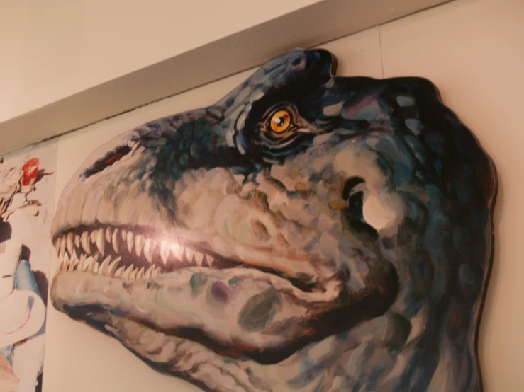 a painting of a t - rex on a wall with a child's wall toy