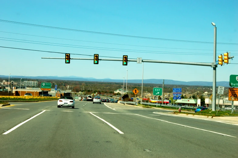 a road with traffic lights on the side of it