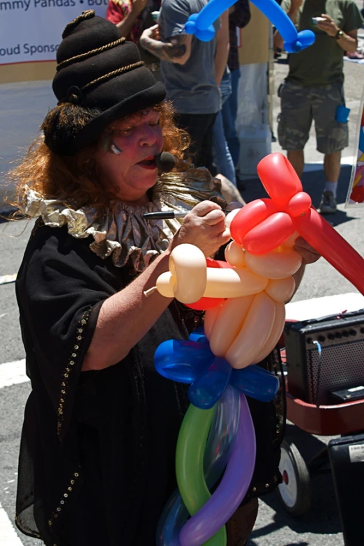 an old woman holding balloons for balloon blow - ups