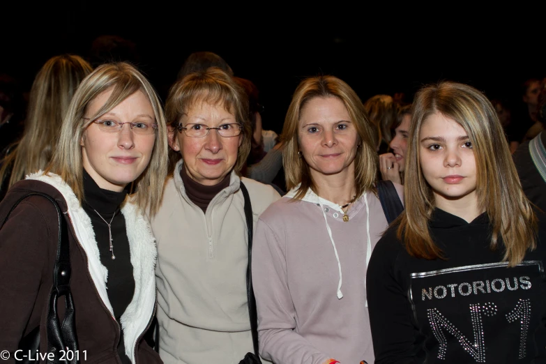 three women pose for a po while wearing glasses