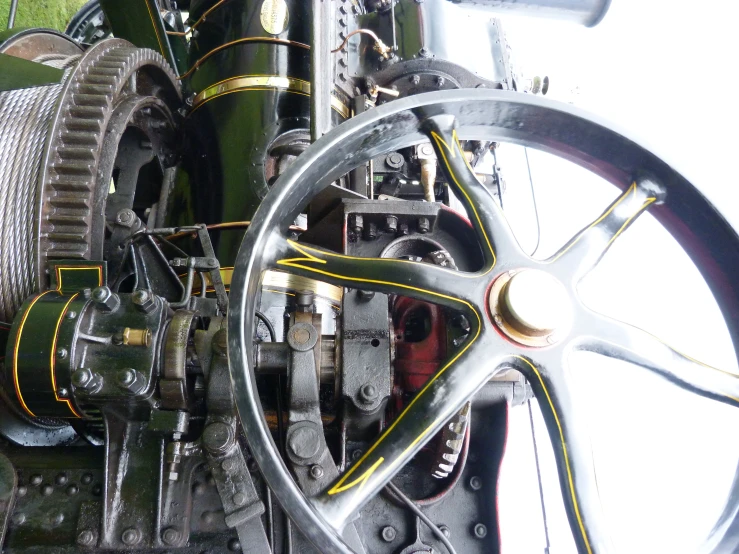 the steering wheel and spokes on a locomotive car