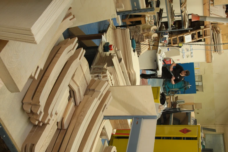 several pieces of unfinished furniture are sitting on tables