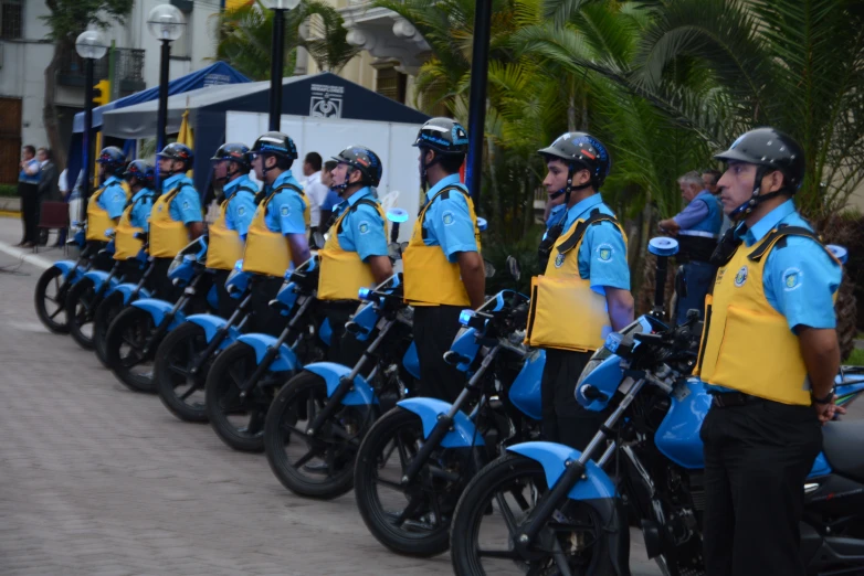 several police officers in uniform on motor bikes