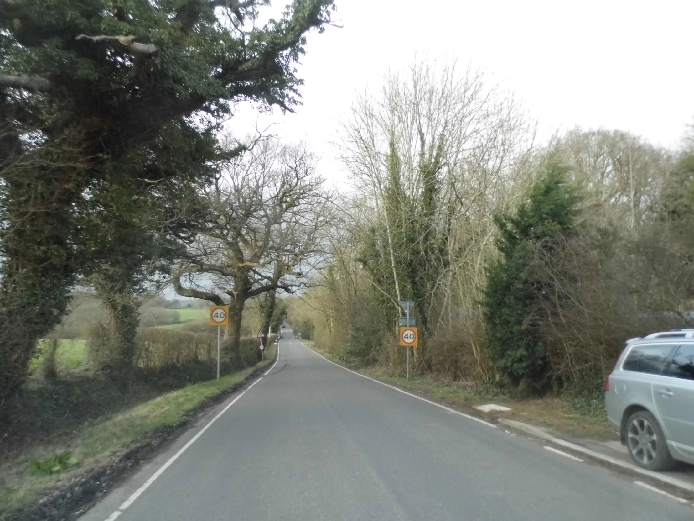 a car driving down a curvy road in the country side