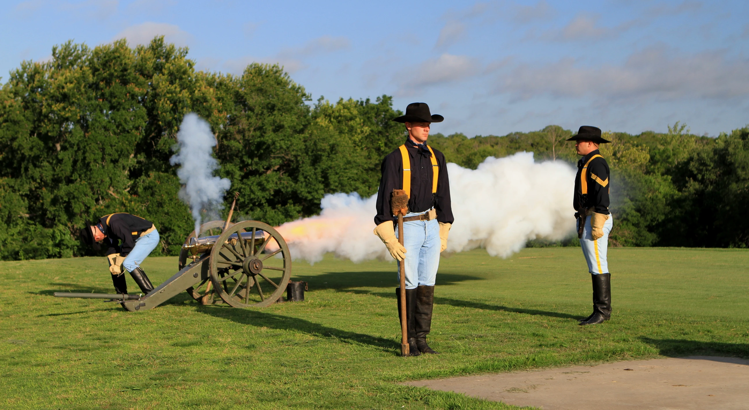 a couple of soldiers standing on top of a field