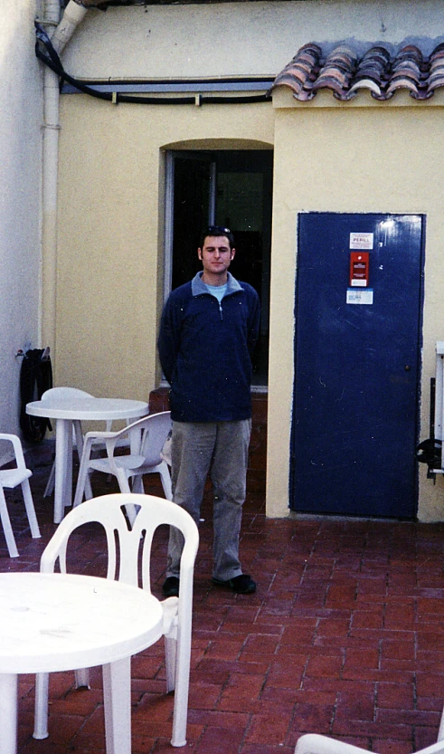 a man is standing in the back of a building