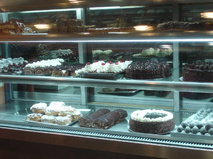 display case filled with different kinds of baked goods
