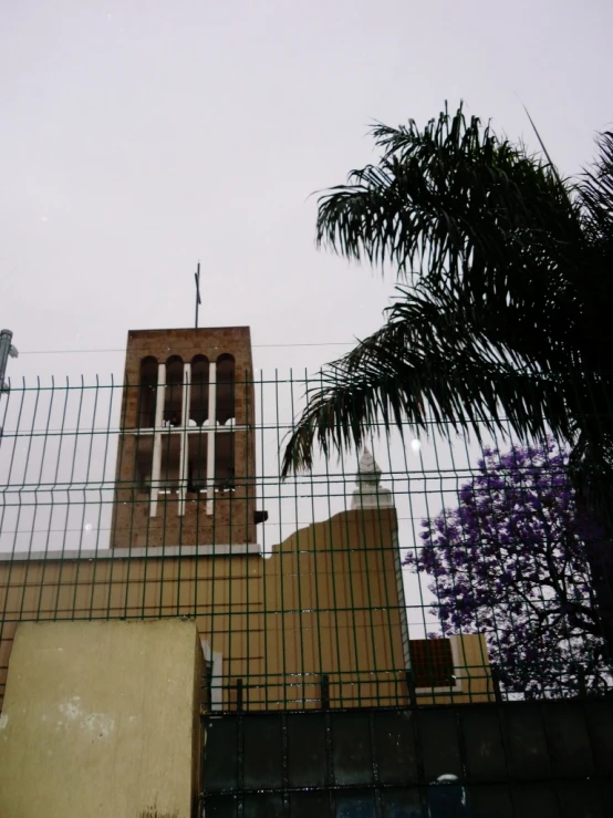 an image of a very tall tower with a cross