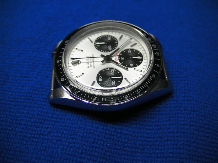 the rolex rolex daytona watch is worn by a man