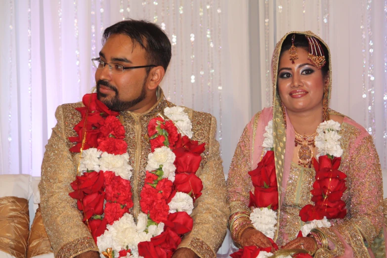 a man and woman dressed in colorful clothing