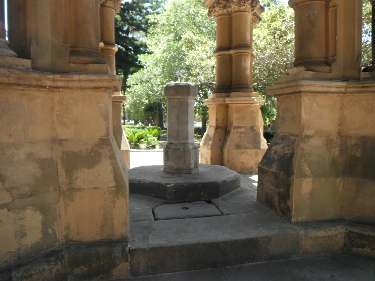 a group of pillars sitting next to each other on top of cement blocks