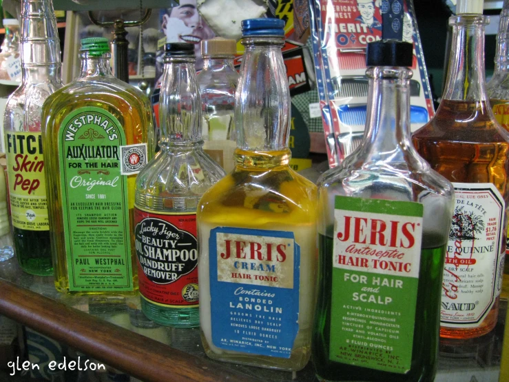 a variety of liquor bottles lined up on a counter