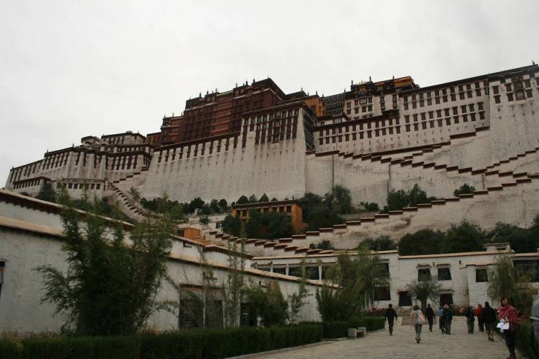 tourists walking up steps to the great wall of china