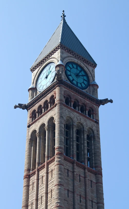 a clock tower is shown against the sky