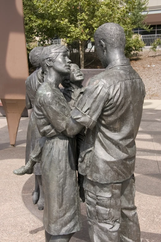 the statue shows two people holding each other
