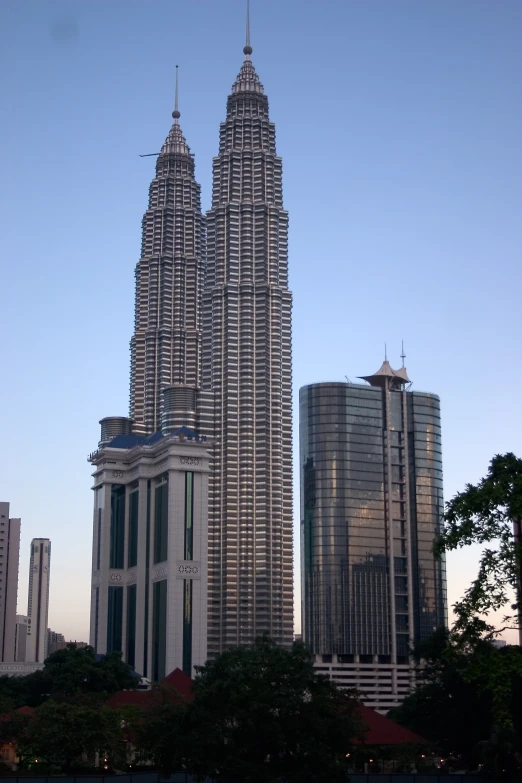 a city with tall buildings in front of blue sky