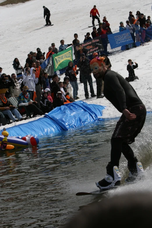 a person with skis on skating in the water