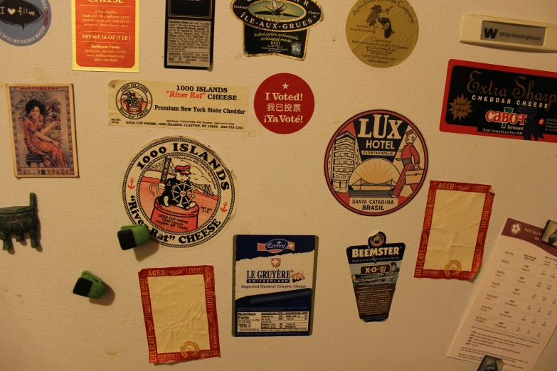 there are many different badges on the refrigerator