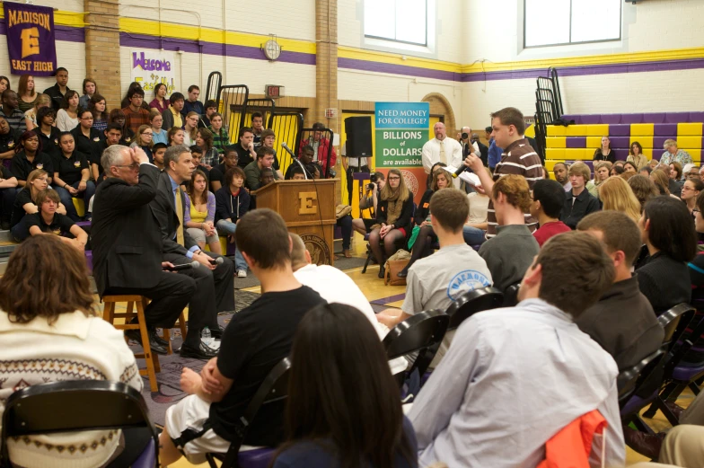 a group of people in a large hall