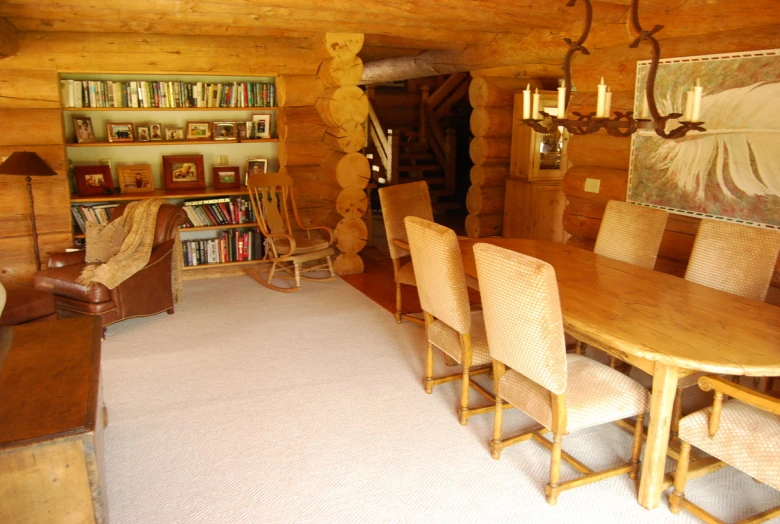 the inside of a log cabin with many items on display