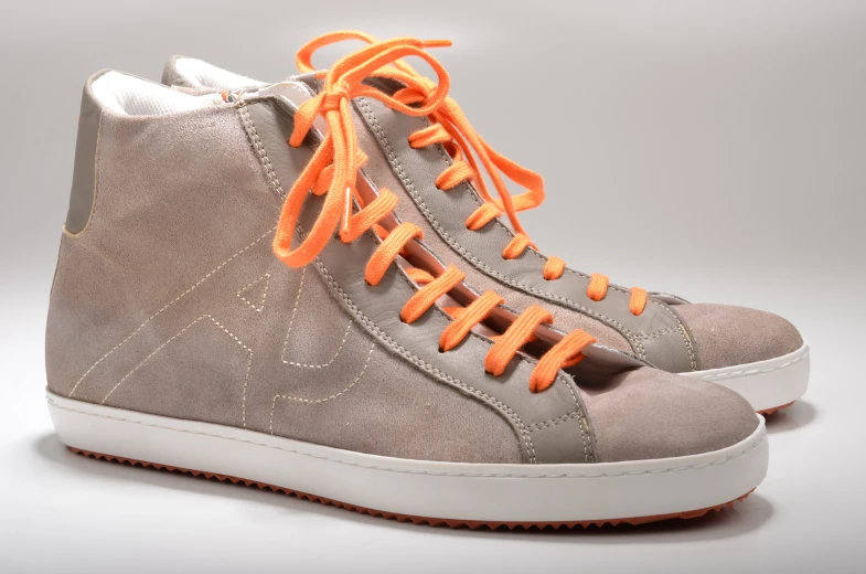 grey and orange high top sneaker with white soles