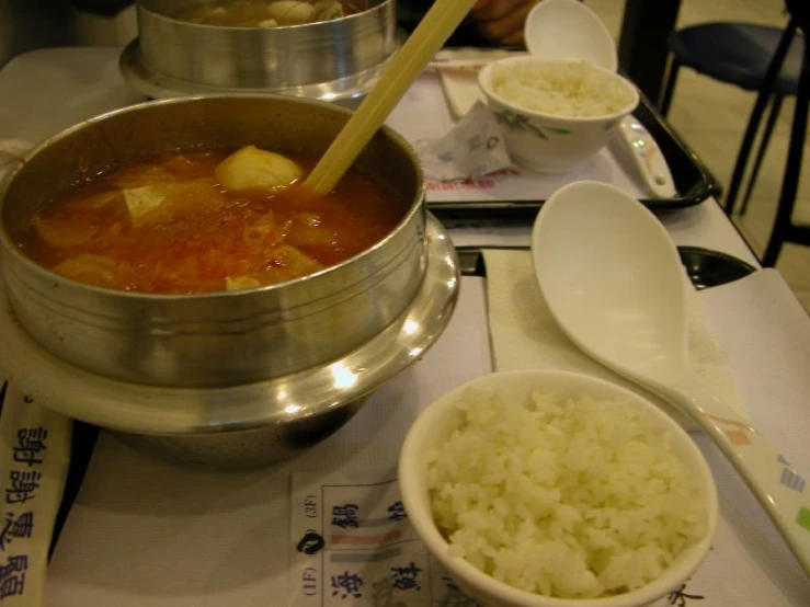 an array of asian food on a dinner table