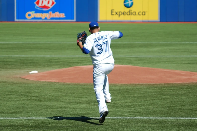 pitcher preparing to throw baseball from the outfield