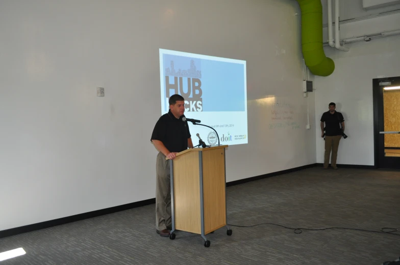 a man is giving a lecture at an event