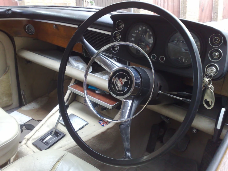 a classic car with wood trim, leather and dashboard