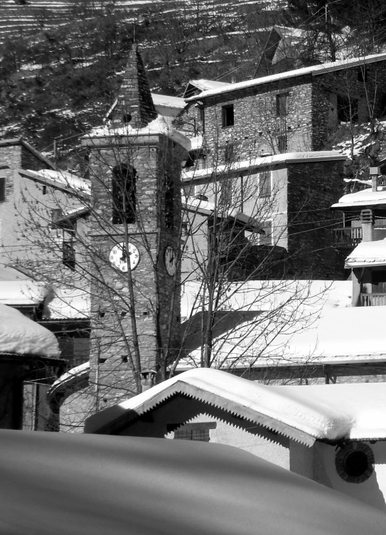 a snow covered roof, and rooftop with a building near it